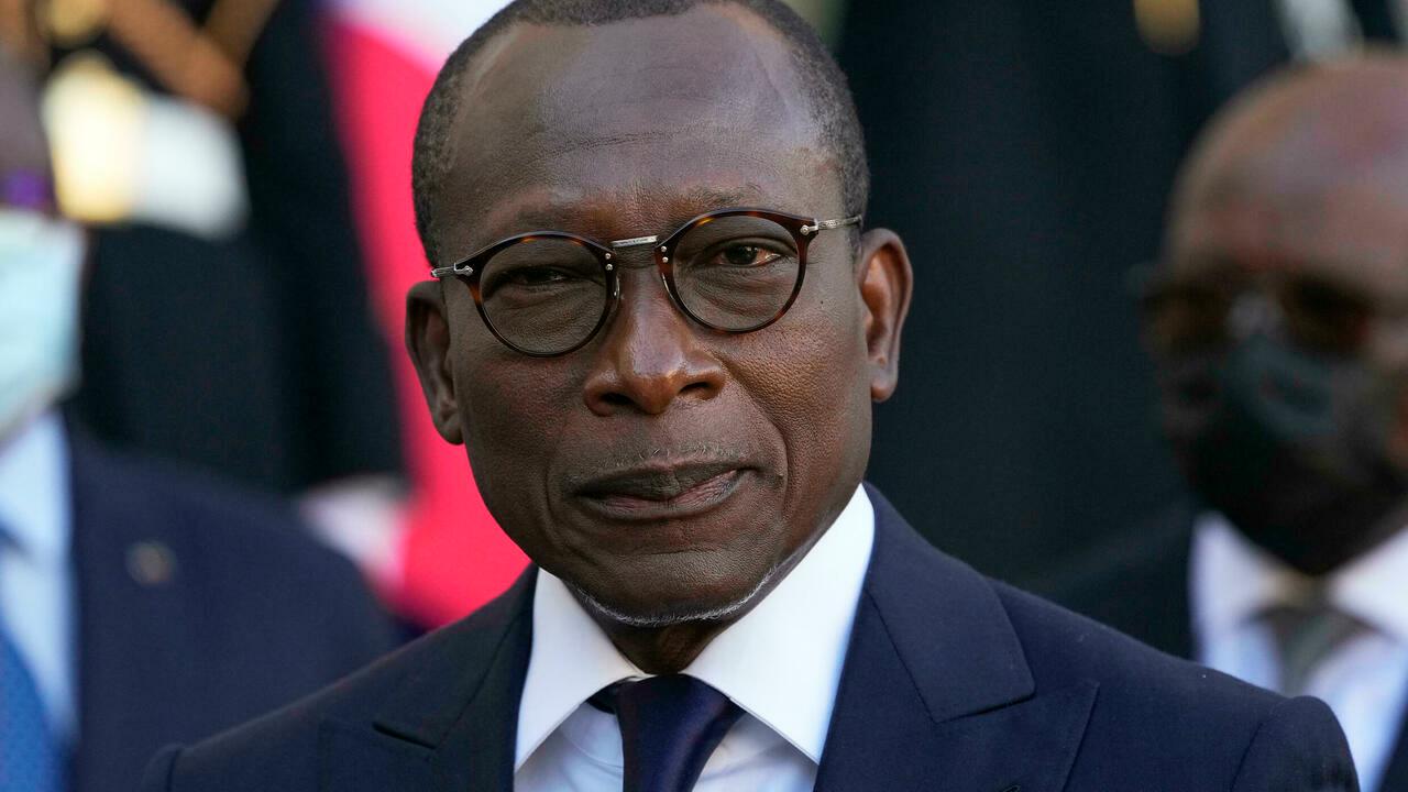 Benin President Patrice Talon listening to French President Emmanuel Macron after a sining ceremony at the Elysee Palace in Paris, Tuesday, Nov. 9, 2021. France hand over in an official signing ceremony 26 looted colonial-era artifacts to the government of Benin. (AP Photo/Michel Euler)
