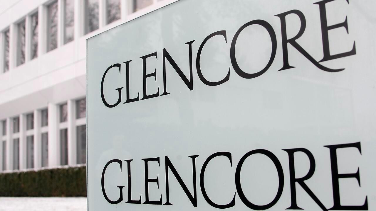 Logos are seen in front of Swiss commodities trader Glencore building in Baar near Zurich in this January 5, 2010 file photo. Commodities trading giant Glencore International plc plans to raise up to $12.1 billion in an initial public offering in London and Hong Kong, according to a term sheet seen by Reuters on Thursday. REUTERS/Christian Hartmann/Files (SWITZERLAND – Tags: BUSINESS)