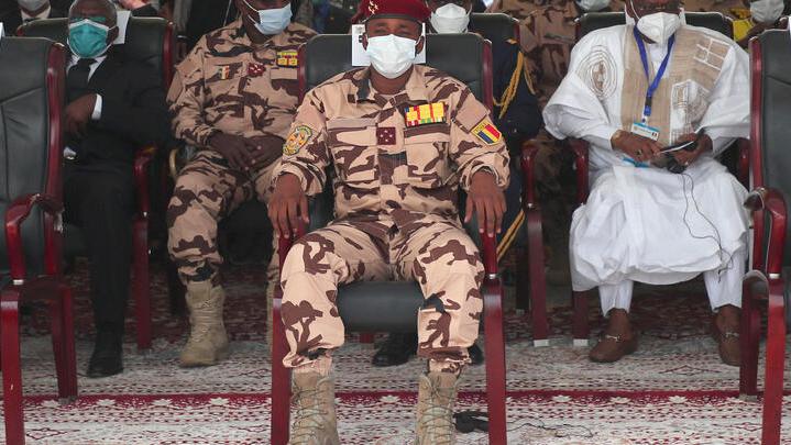 epa09154274 Son of the late Chadian president Idriss Deby, general Mahamat Idriss Deby (C) sits in the front row as he attends the state funeral for the late Chadian president Idriss Deby in N&rsquo;Djamena, Chad, 23 April 2021. Chad&rsquo;s President Idriss Deby died of injuries suffered in clashes with rebels in the country&rsquo;s north, an army spokesperson announced on state television on 20 April 2021. Deby had been in power since 1990 and was re-elected for a sixth term in the 11 April 2021 elections. The state funeral is attended by French President Emmanuel Macron, among other dignitaries. EPA-EFE/CHRISTOPHE PETIT TESSON / POOL