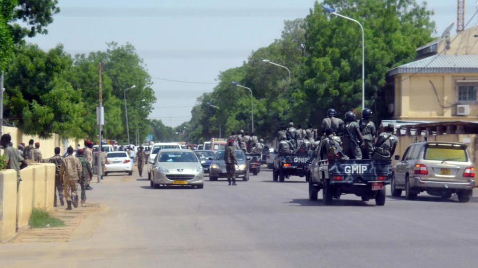 A picture taken on June 15, 2015 shows police forces and soldiers patrolling outside the police headquarters in N’Djamena, in which 23 were killed along with a simultaneous attack. Twenty-three people were killed and another 101 wounded on June 15 in N’Djamena in twin suicide bombings outside the police headquarters and police academy, that the government said was the work of Boko Haram militants. They were the first such attacks in the capital of the central African nation, which has been on the frontline of the regional fight against the Nigerian Islamist group. AFP PHOTO / BRAHIM ADJI / AFP PHOTO / BRAHIM ADJI
