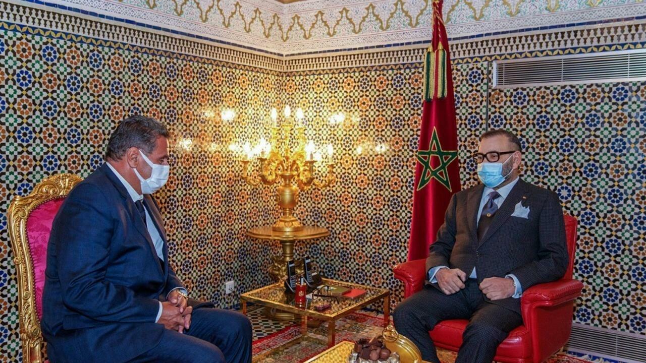 This handout picture released by the Moroccan Royal Palace shows King Mohammed VI (R) receiving the head of the National Rally of Independents (RNI) Aziz AKhannouch at the Royal Palace in the central city of Fes, on September 10, 2021, to task him with forming a new government. – Akhannouch’s RNI won 102 of parliament’s 395 seats, trouncing the moderate Islamist Justice and Development Party (PJD), which had headed the governing coalition for a decade but took just 13 seats, according to results released by the interior ministry. (Photo by azzouz boukallouch / Moroccan Royal Palace / AFP) / RESTRICTED TO EDITORIAL USE – MANDATORY CREDIT « AFP PHOTO / SOURCE / MOROCCAN ROYAL PALACE- NO MARKETING NO ADVERTISING CAMPAIGNS – DISTRIBUTED AS A SERVICE TO CLIENTS