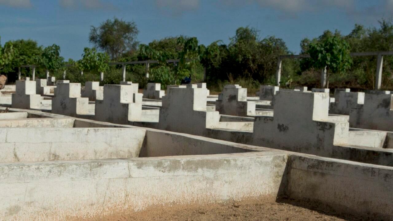 A woman prays while visiting a cemetery containing 140 unmarked graves of victims of the 2002 Joola ferry disaster, in Mbao, outside Dakar, Senegal, on Wednesday, Sept. 26, 2012, the tenth anniversary of the ferry’s sinking. With an official death toll of 1,863 and only 64 survivors, the Joola disaster remains one of the deadliest in maritime history, surpassing by a large margin the death toll of roughly 1500 in the 1912 sinking of the Titanic.(AP Photo/Rebecca Blackwell)