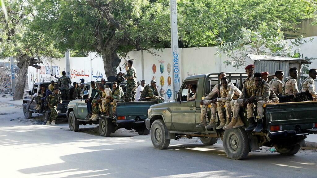 Somali military supporting Prime Minister Mohamed Hussein Roble ride on their pick-up trucks as they gather at Siigale village in Hodan district of Mogadishu, Somalia December 27, 2021. REUTERS/Feisal Omar