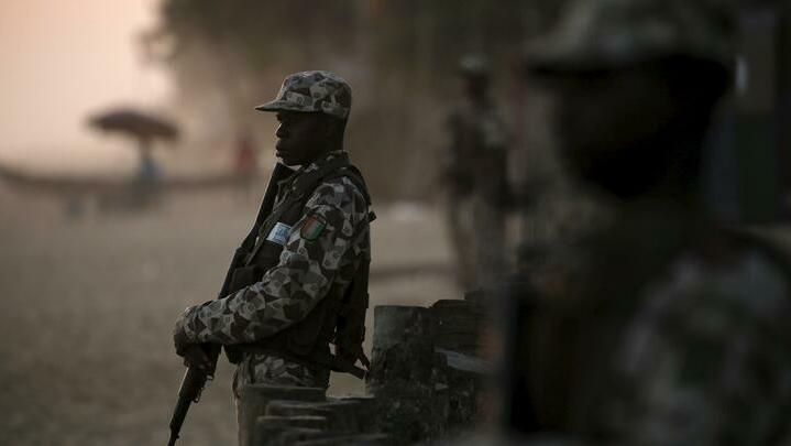 Soldiers stand guard on the beach after an attack in Grand Bassam, Ivory Coast, March 13, 2016. REUTERS/Joe Penney