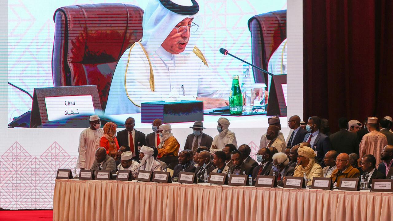 Participants listen to a speech by Qatar’s Minister of State for Foreign Affairs Sultan bin Saad Al-Muraikhi as the Chad Peace Negotiations start in Qatar’s capital Doha, on March 13, 2022. (Photo by KARIM JAAFAR / AFP)