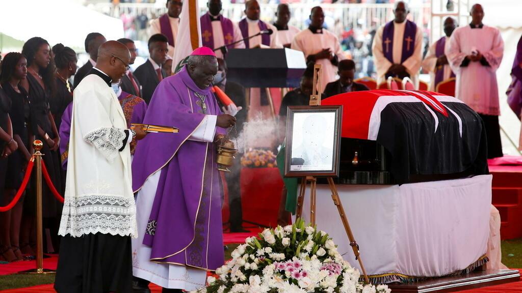 Catholic Archbishop Phillip Anyolo blesses the coffin of late former Kenyan President Mwai Kibaki, during a state funeral at the Nyayo Stadium, the venue of the national memorial service, in Nairobi, Kenya, April 29, 2022. REUTERS/Monicah Mwangi