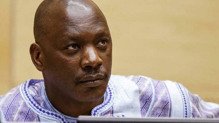 FILE PHOTO: Former Congolese warlord Thomas Lubanga awaits the judges’ verdict in the courtroom of the International Criminal Court (ICC) in The Hague, December 1, 2014. Appeal judges at the International Criminal Court on Monday upheld the conviction of Congolese war criminal Thomas Lubanga, bringing to a close the permanent war crimes court’s first case. Lubanga, 53, who has been on trial since 2006, was convicted of war crimes for using child soldiers during a conflict in the Democratic Republic of Congo in 2002/03. REUTERS/Michael Kooren (NETHERLANDS – Tags: POLITICS CRIME LAW CIVIL UNREST CONFLICT HEADSHOT) – GM1EAC201NS01/File Photo