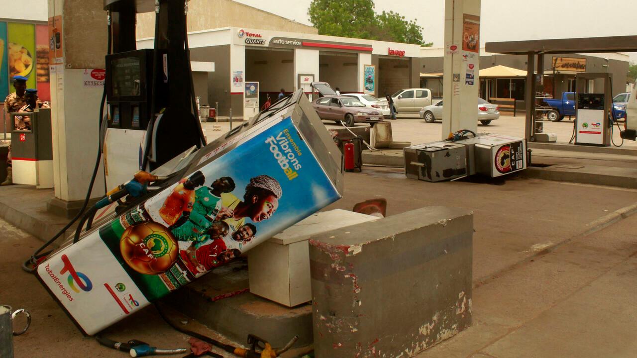 Uprooted petrol pumps lie in the forecourt of a Total petrol station after an anti-French protest in N’Djamena on May 14, 2022. – Several hundred people demonstrated against the French presence in Chad, an AFP reporter noted. The protesters burned at least two flags of the former colonial power and vandalised several Total petrol stations, a « symbol » of France, tearing off pumps and taking away some of the products on display, the same source said. (Photo by AFP)