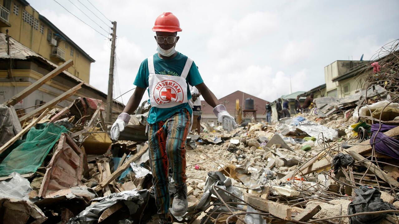 Rescue workers search for survivors at the site of a collapsed three-story building in Ebutte- Metta, in Lagos, Nigeria, Monday, May 2, 2022. A three-story residential building has collapsed in Lagos, Nigeria’s largest city, killing at least five people with many feared trapped, emergency response services said Monday. (AP Photo/Sunday Alamba)