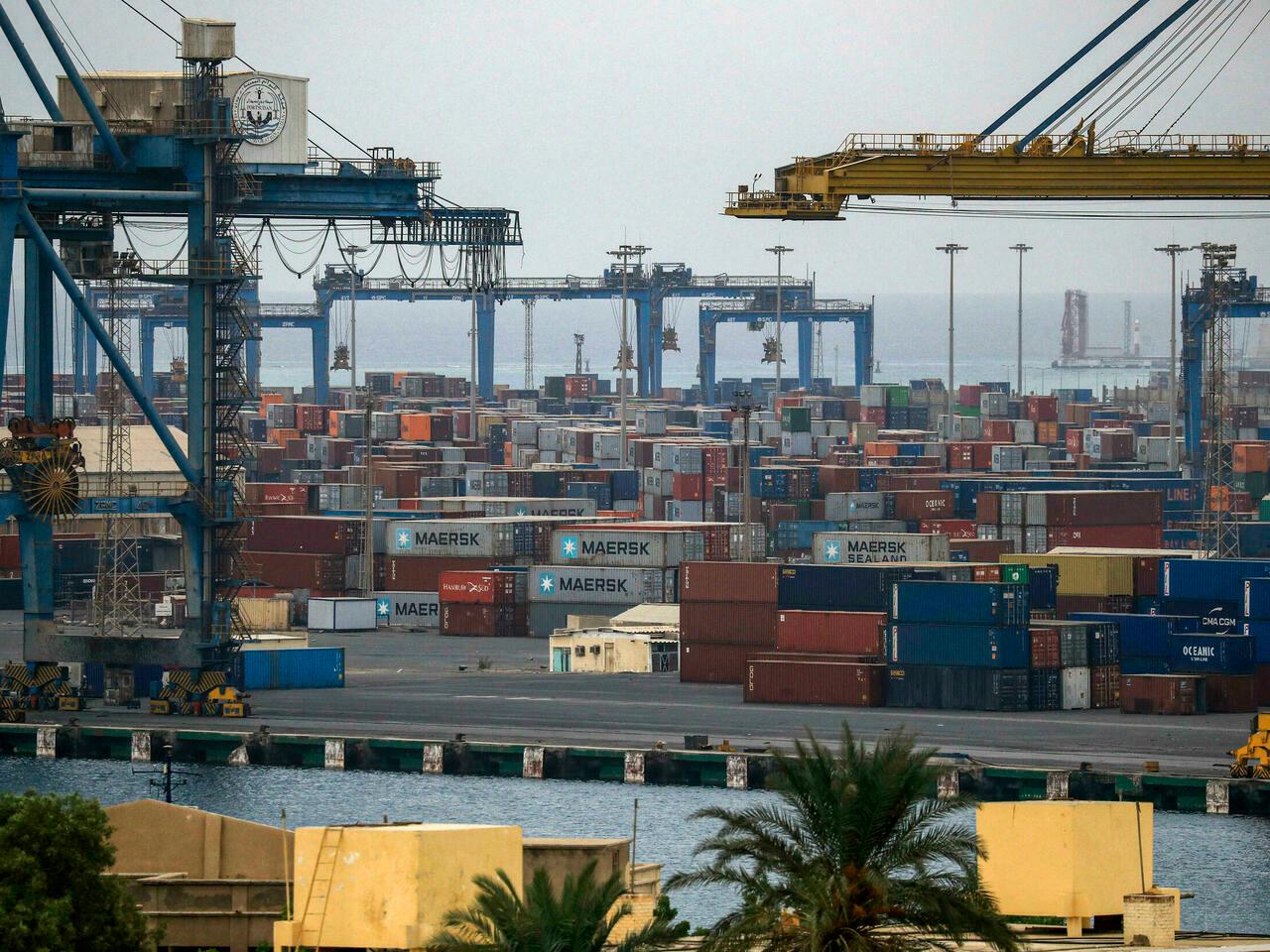 (FILES) This file photo taken on October 9, 2021, shows an elevated view of the shipping port of Port Sudan along the Red Sea in the country’s northeast. – From Washington to Moscow, Tehran to Ankara, Sudan’s strategic Red Sea ports, blockaded for a month by protesters, have long been eyed by global powers far beyond Africa’s borders. (Photo by Ashraf SHAZLY / AFP)