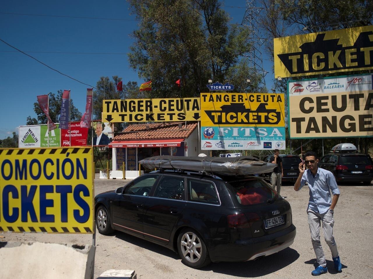 A man waits in front of the ticket office before embarking on a ferry bound for Tangier at the Algeciras port on July 27, 2019. – Thousands of Moroccan nationals working and living in Europe pass through the Strait of Gibraltar as they return to spend summer holidays in Morocco. (Photo by JORGE GUERRERO / AFP)