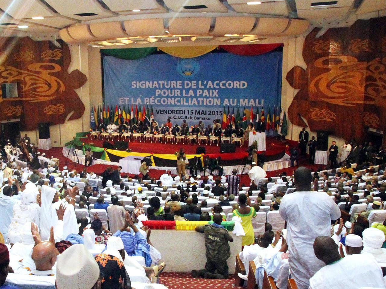 African heads of state and officials attend a ceremony for the signing of a peace accord between Mali’s government and several armed groups on May 15, 2015 in Bamako. Mali’s government and several armed groups signed a peace accord May 15 in a ceremony attended by numerous heads-of-state but missing the crucial backing of the main Tuareg-led rebel groups. The Coordination of Azawad Movements (CMA) had provisionally initialled the document a day earlier but is demanding concessions and its three principal factions did not attend the rubber-stamping ceremony in the Malian capital Bamako. AFP PHOTO / HABIBOU KOUYATE
